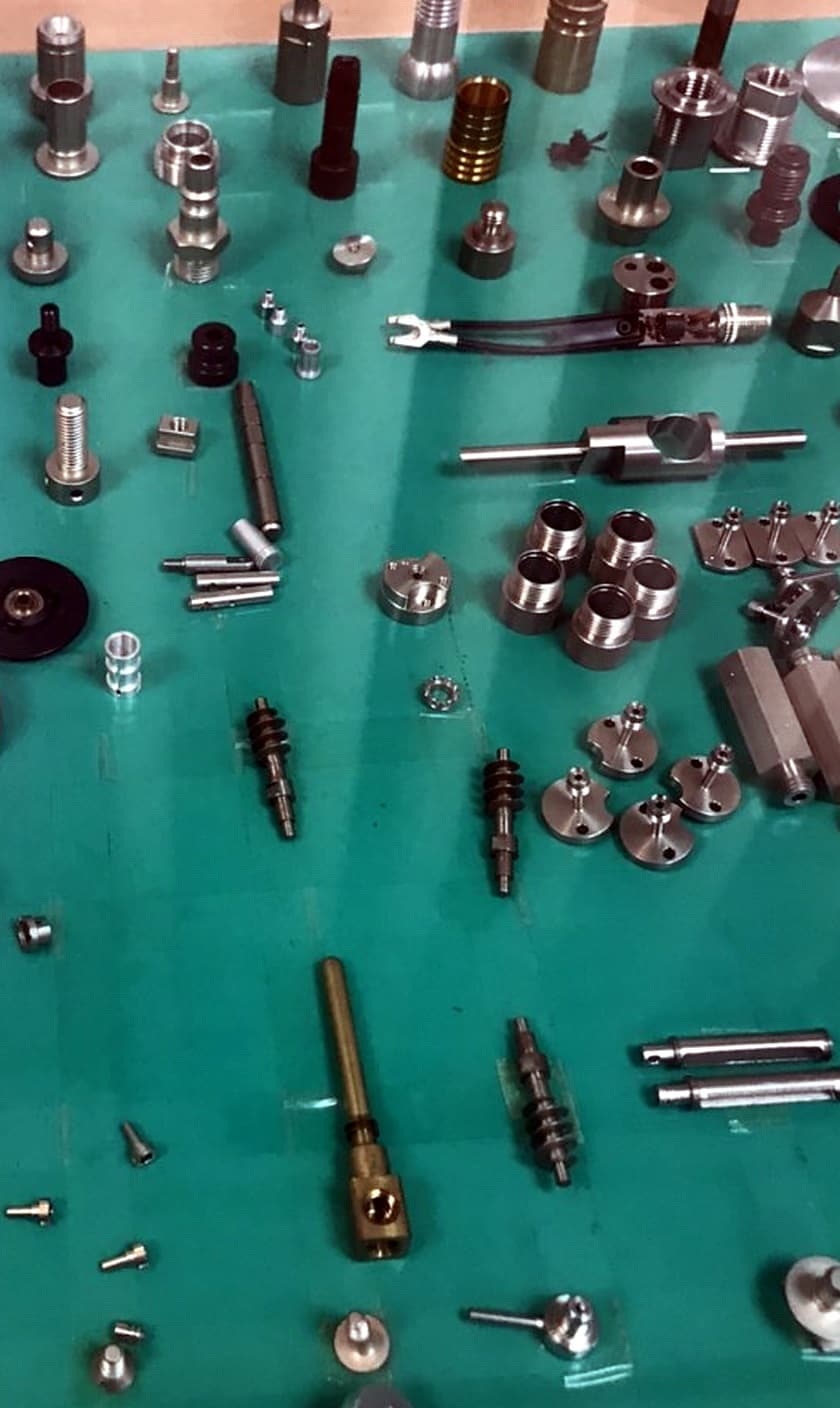 Machined sample part from a supplier, photographed on a plain background