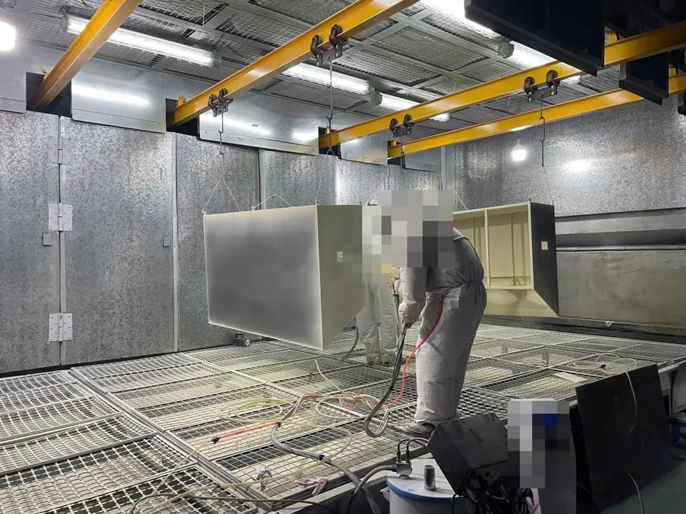 Representative powder-coating spray booth at a partner factory